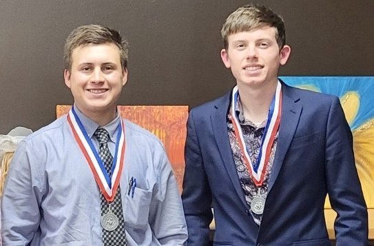 Students with debate medals