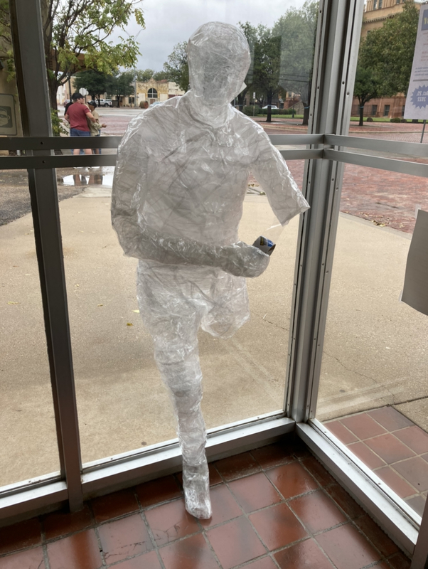 packing tape person with bottle